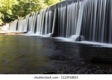 A Waterfall Over A Dam.  Old Stone Fort State Archaeological Park, Manchester, TN, USA.