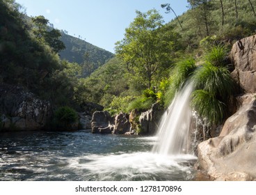 Waterfall in a peaceful river - Shutterstock ID 1278170896
