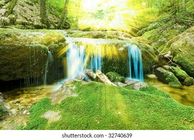 waterfall in a rays of sun
