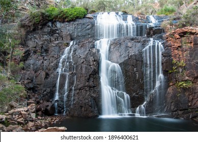 Waterfall showing motion of water into a still pool.