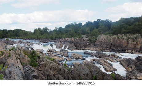 Waterfall in summer time with blue sky and some clouds at Great Falls Park, Fairfax County, Virginia