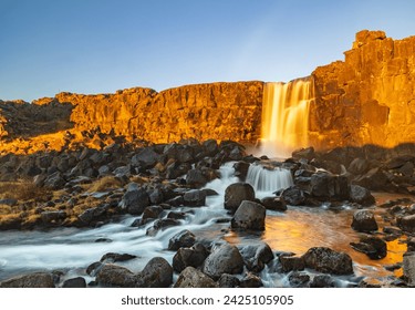 Öxarárfoss Waterfall at sunrise in Thingvellir National Park, Selfoss, Iceland	