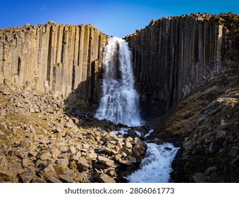 Stuðlafoss Waterfall surrounded by basaltic columns
.
Stuðlafoss Waterfall is located in the eastern part of Iceland. Reachable as daytrip from Egilsstaðir.