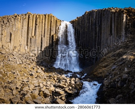 Stuðlafoss Waterfall surrounded by basaltic columns
.
Stuðlafoss Waterfall is located in the eastern part of Iceland. Reachable as daytrip from Egilsstaðir.