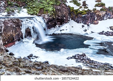 

A waterfall surrounded by ice and snow in the highlands of Iceland framed rugged terrain offers scenic landscape epitomizing the frozen wilderness. 

 - Powered by Shutterstock