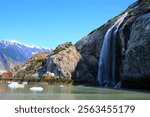 Waterfall in the Tracy Arm fjord in the Boundary Ranges of Alaska, United