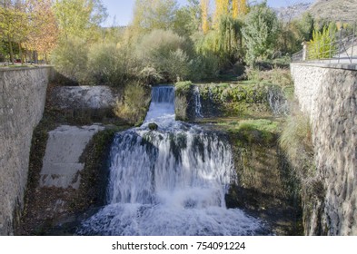Waterfall with trees around it