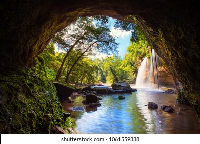 Waterfall in tropical forest at Khao Yai National Park, Thailand. Waterfall view from inside the cave.