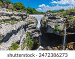 Waterfall of the Tsievna river in karst rocks, Podgorica, Montenegro.