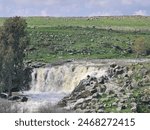 Waterfall and water flowing in Nov wadi, Golan Heights, Israel