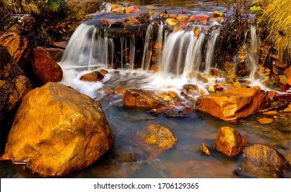 Waterfall Water Flowing On Creek Stones