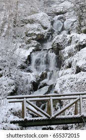 waterfall in winter with Bridge
