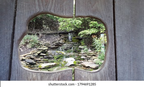 Waterfall With Wooden Wall Fram