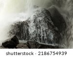 Waterfall in the woodland, mountain. Rocks, cliffs and casades of water. Powerful place.