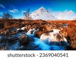 Waterfalls at the foot of the Buachaille Etive Mor mountain in the background at Glen Etive in Glencoe in the Highlands of Scotland