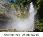 Waterfalls mist in rock structures. Hikong Bente Falls. South Cotabato, Philippines.