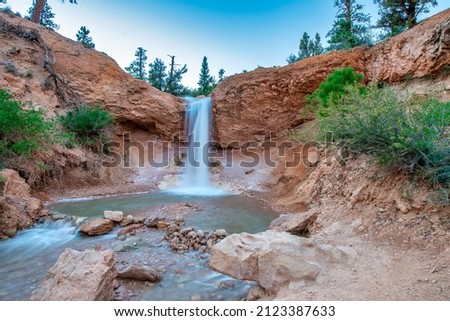 Waterfalls in Mossy Cave Trail at sunset, Bryce Canyon National Park in summer season