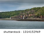 Waterfalls pouring into the Bay of Fundy from the north shore at Digby Gut Nova Scotia