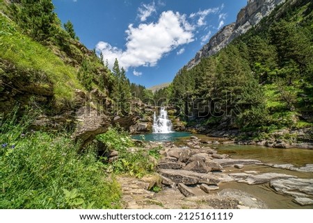 Waterfalls of the river Ara in the Ordesa valley on a sunny day, Aragon, Huesca, Spain.