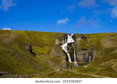 Waterfalls, Rocky Cliffs, Greenery, Houses  - Powered by Shutterstock