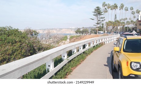 Waterfront Or Beachfront Promenade With Palmtrees. Yellow Car And Palm Trees, Rocky Point In La Jolla, San Diego, California Coast, USA. Summer Tropical Boardwalk Aesthetic. Waterside City Street.