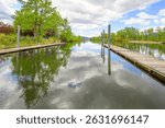Waterfront boat launches and fishing piers on the narrow Saint Joe River in Saint Maries, North Idaho.