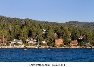 Waterfront Homes Among The Pine Trees Along The Shoreline Of Lake Tahoe, Nevada, USA