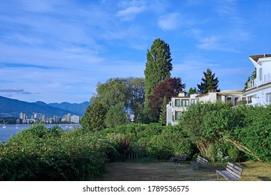 Waterfront Park In West Point Grey Area Of Vancouver, With Distant View Of City Skyline