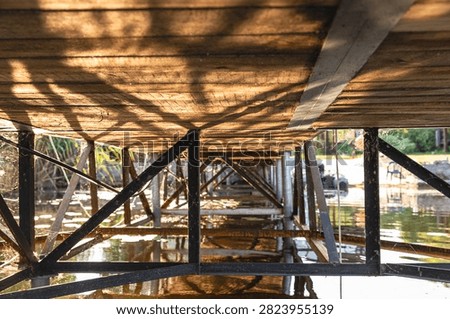 Waterfront Property Dock Structure Beneath Wooden Pier at Private Lake