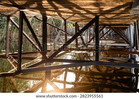 Waterfront Property Dock Structure Beneath Wooden Pier at Private Lake