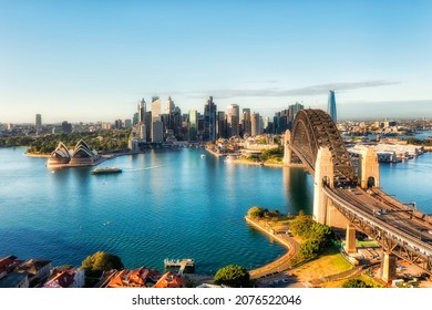 Waterfront Of Sydney City CBD Across Harbour Near Sydney Harbour Bridge In Aerial View From Kirribilli Of North Shore.