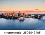 Waterfront of Sydney city CBD architecture landmarks on shores of Sydney Harbour aerial cityscape.