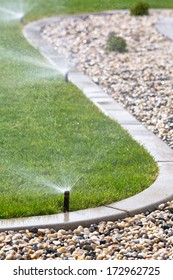 Watering Lawn With Sprinklers