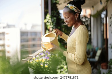 Beautiful woman watering plants on the balcony
 - Powered by Shutterstock