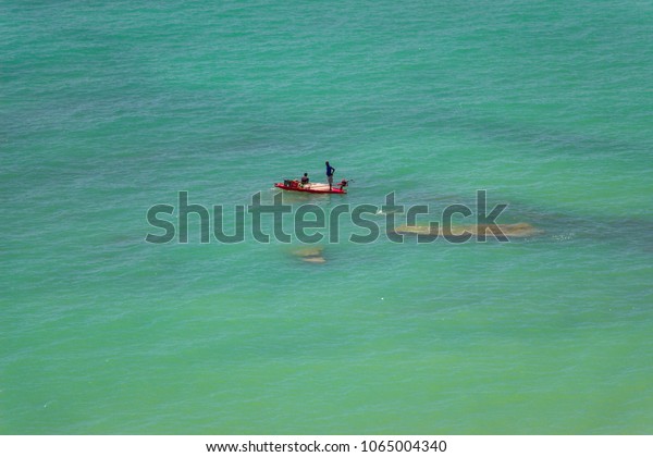 \
Waterline in paradisiac Carro Quebrado (Broken\
Car) beach Broken in the Brazilian northeast. Clear turquoise blue\
water. Alagoas,\
Brazil