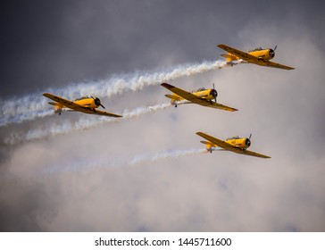 Waterloo, Ontario/Canada - July 8, 2019: Canadian Harvards fly in formation at the Waterloo Airshow. The aircraft is a part of the Canadian Air Force Heritage Flight. 