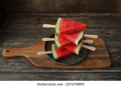 Watermellon Slices On Wooden Background