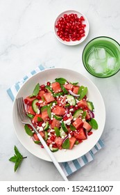 Watermelon, Cucumber, Feta And Mint Salad In White Bowl, Marble Background, Top View