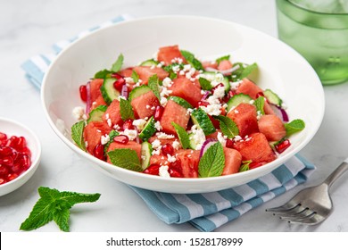 Watermelon, Cucumber, Feta And Mint Salad In White Bowl, Marble Background, Selective Focus