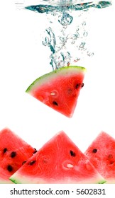 watermelon are falling in water with a big splash