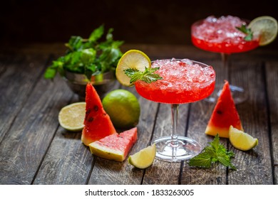 Watermelon Frozen Cocktail Margarita With Fresh Watermelon, Lime And Mint On Wooden Background