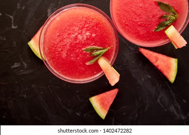 Watermelon Margarita Cocktail On Black Background. Fresh Watermelon Lemonade With Mint And  Ice For Summer Party. Refreshing Summer Drink. Top View.