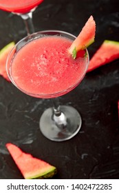 Watermelon Margarita Cocktail On Black Background. Fresh Watermelon Lemonade With Mint And  Ice For Summer Party. Refreshing Summer Drink.