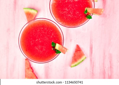 Watermelon Margarita Cocktail On Pink Background. Fresh Watermelon Lemonade With Mint And  Ice For Summer Party. Refreshing Summer Drink. Top View.