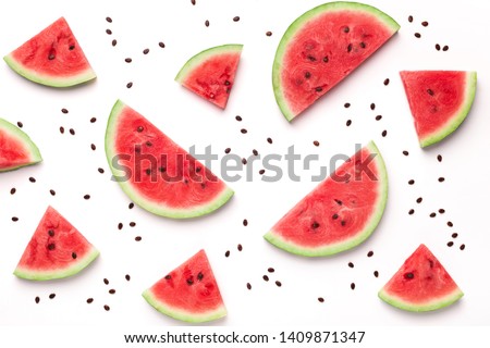 Watermelon pattern. Sliced watermelon and seeds on white background, top view