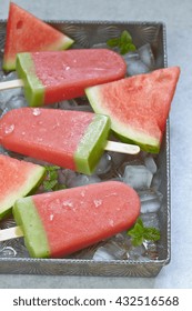 Watermelon Popsicle With Ice Cubes On Tray