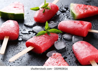 Watermelon Popsicle On The Black Wooden Table