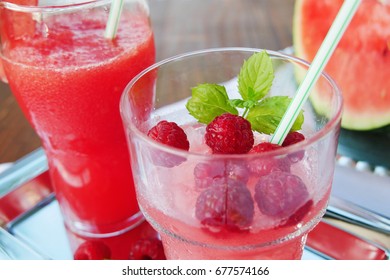 Watermelon and raspberry shaved ice slush summer refreshment drinks in glasses - Shutterstock ID 677574166