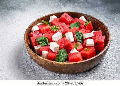 Watermelon Salad With Feta Cheese In A Wooden Plate. White Background. Top View