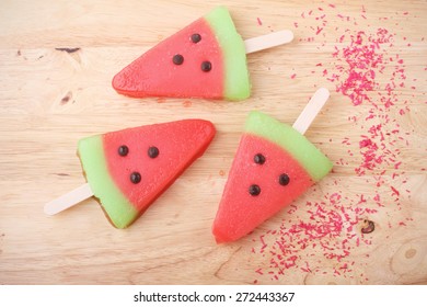 Watermelon Shaped Ice Cream Pops Lay On Wooden Plate